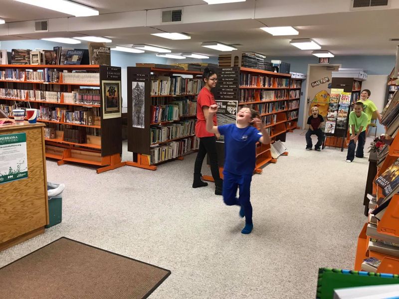Boy having fun at the library